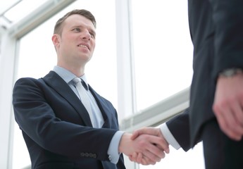 handshake of business partners after a favorable trade deal