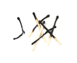 Pile of burnt matches isolated on white background, top view