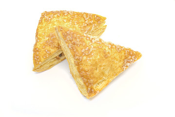 Two crispy apple pies isolated on white background