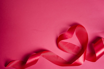 Obraz na płótnie Canvas Valentines day greeting card. Heart shaped red ribbon