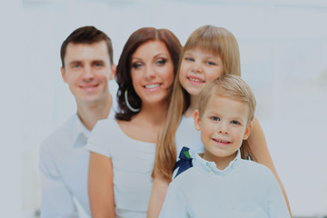 Fototapeta premium Beautiful happy family - isolated over a white background.