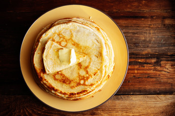 Pancakes with banana, nuts and honey. Traditional Russian cuisine. Maslenitsa. Dessert.