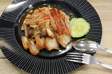 crispy pork rice mix roasted duck in dish of Thai foods style.