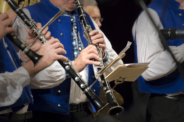 Fototapeta premium detail of playing clarinets, brass orchestra