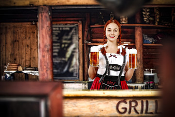 Fototapeta na wymiar Bavarian woman and her own small business. Grill bar interior. 