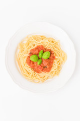 tatsty fresh spaghetti with tomato sauce fresh basil isolated on white background