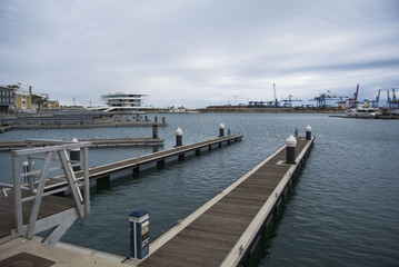 Empty docks in Valencia port, Spain. Valencia Port At Mediterranean Sea. Reflexion in the water....