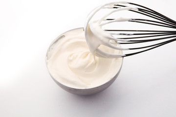 close up of a white whipped or sour cream in bowl