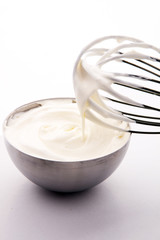 close up of a white whipped or sour cream in bowl