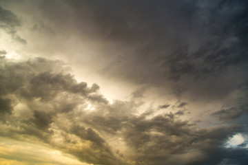 Storm clouds in the sky at sunset as background