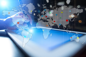 Worlds maps on virtual screen. Business, internet and technology concept.