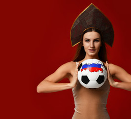 Ruusian style Fan sport woman player in kokoshnik hold soccer ball celebrating happy smiling laughing