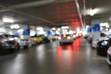 Blurred cars parking and bokeh light.