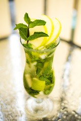 Alcohol bar, cocktail glass on bar counter, cocktail glass in a bar, Drinking cocktail in bar, cocktail in the glass with straws, Fresh drink coctail on a color background