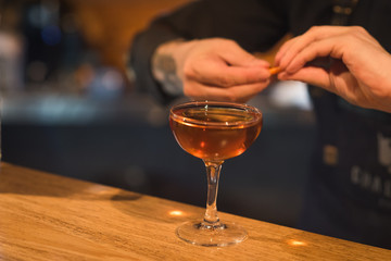 Alcohol bar, cocktail glass on bar counter, cocktail glass in a bar, Drinking cocktail in bar, cocktail in the glass with straws, Fresh drink coctail on a color background