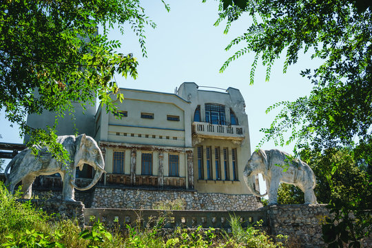 Abandoned cottage, house with statue of two elephants in Samara, Russia