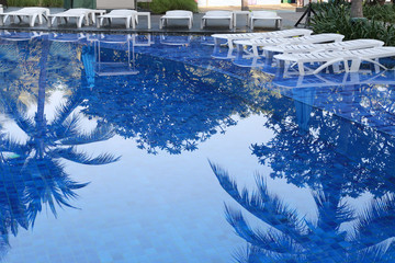 Blue swimming pool of resort in a daytime.