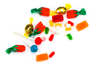 Colorful candies and lollipops isolated over white background