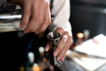 Alcohol bar, cocktail glass on bar counter, cocktail glass in a bar, Drinking cocktail in bar, cocktail in the glass with straws, Fresh drink coctail on a color background
