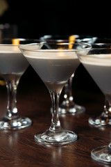 Alcohol bar, cocktail glass on bar counter, cocktail glass in a bar, Drinking cocktail in bar, cocktail in the glass with straws, Fresh drink coctail on a color background
