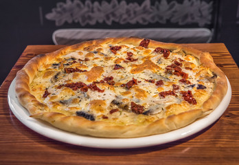 Hot delicious pizza freshly cooked in a cafe