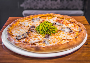 Hot delicious pizza freshly cooked in a cafe