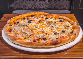 Hot delicious pizza freshly cooked in a cafe