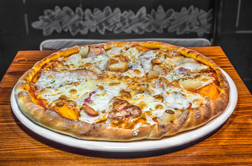 Hot delicious pizza freshly cooked in a cafe