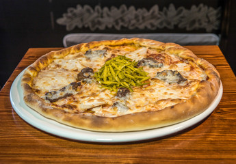 Hot delicious pizza freshly cooked in a cafe