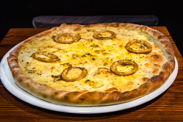 Hot delicious pizza freshly cooked in a cafe