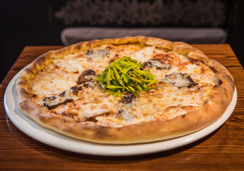 Hot delicious pizza freshly cooked in a cafe
