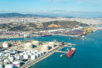 Fototapeta na wymiar Tank farm for energy supply and cargo shipping in the seaport of Barcelona, the Zona Franca - Port 