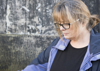 Portrait image of a mature woman upset and looking down