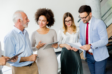 Successful business people standing in the office