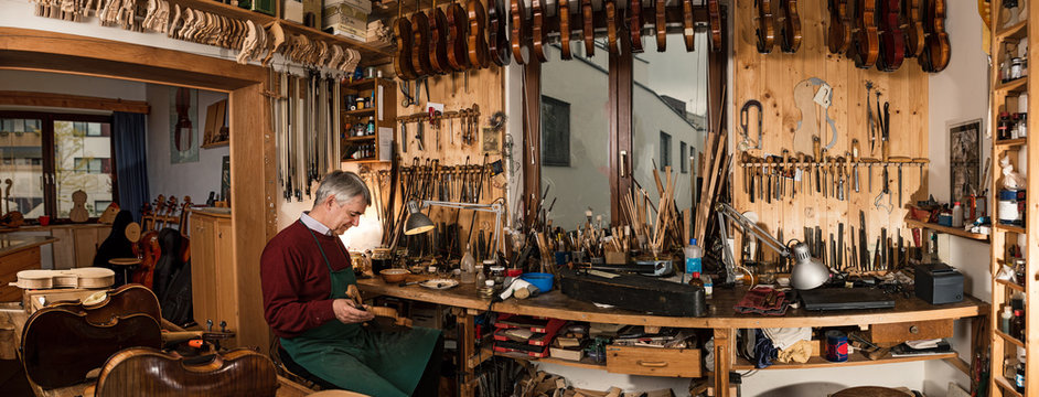 instrument maker working in his workshop