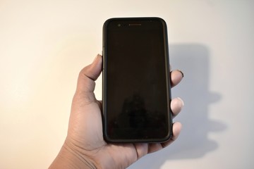 Hand Holding Cellphone On White Background