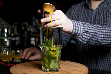 Alcohol bar, cocktail glass on bar counter, cocktail glass in a bar, Drinking cocktail in bar, cocktail in the glass with straws, Fresh drink coctail on a color background