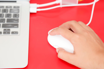 Closeup of hand using computer mouse