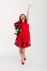 Full length portrait of a joyful young woman