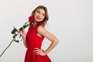 Portrait of a smiling young woman dressed in red dress