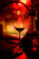 Obraz na płótnie Canvas Alcohol bar, cocktail glass on bar counter, cocktail glass in a bar, Drinking cocktail in bar, cocktail in the glass with straws, Fresh drink coctail on a color background