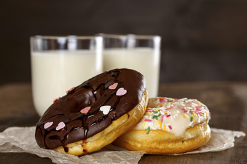 Donuts and a glass of milk on a table