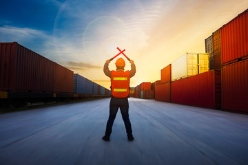 Foreman control  cargo train by light baton  in the container yard port international concept stop fee or free fee.