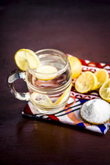 Close up of Indian most popular summer drink Nimbu pani or Nimbo sarbat,Lemonade in a transparent glass with salt.