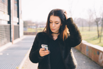 young beautiful woman using smartphone