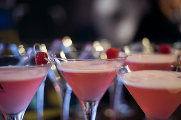 Alcohol bar, cocktail glass on bar counter, cocktail glass in a bar, Drinking cocktail in bar, cocktail in the glass with straws, Fresh drink coctail on a color background