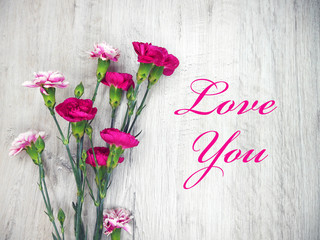 Flowers on a wooden clear background and Love You