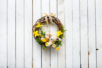 Spring wreath, easter background with eggs and flowers