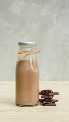 Chocolate milk on a wooden table.