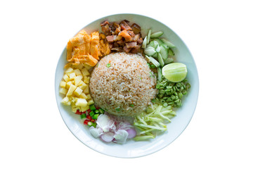 Thai a la carte Kao Klug Kapi isolated white background.Famous thai food included of thai rice, mango sliced, cucumber, pineapple, onion,chilli,omelet,long bean, lemon, and pork .